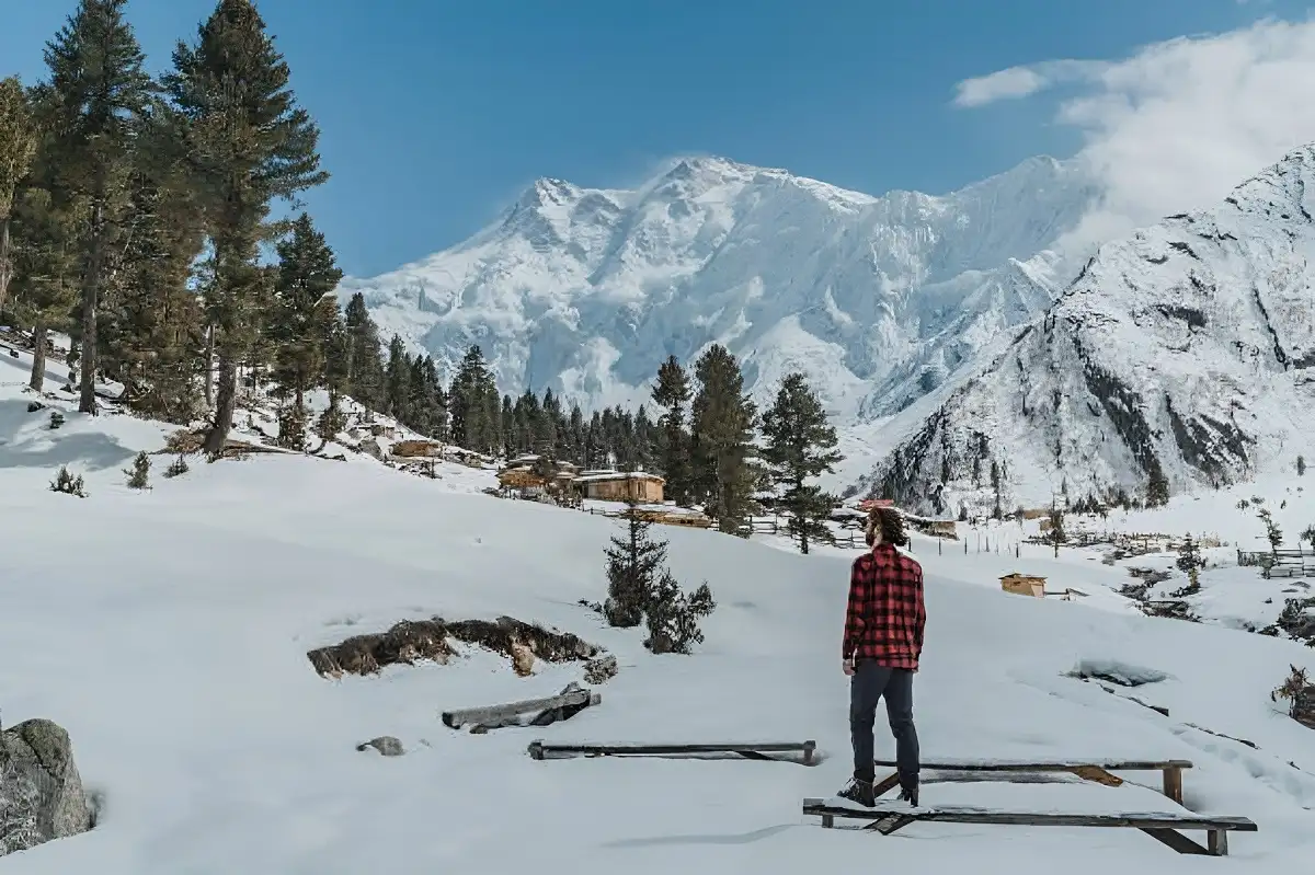 Man standing on the background of Nanga Parbat mountain in Pakistan